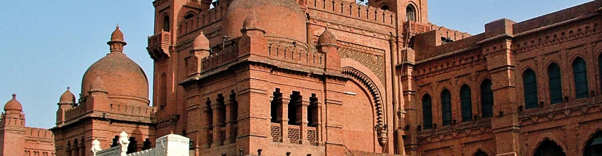 Lahore night skyline with parked cars
