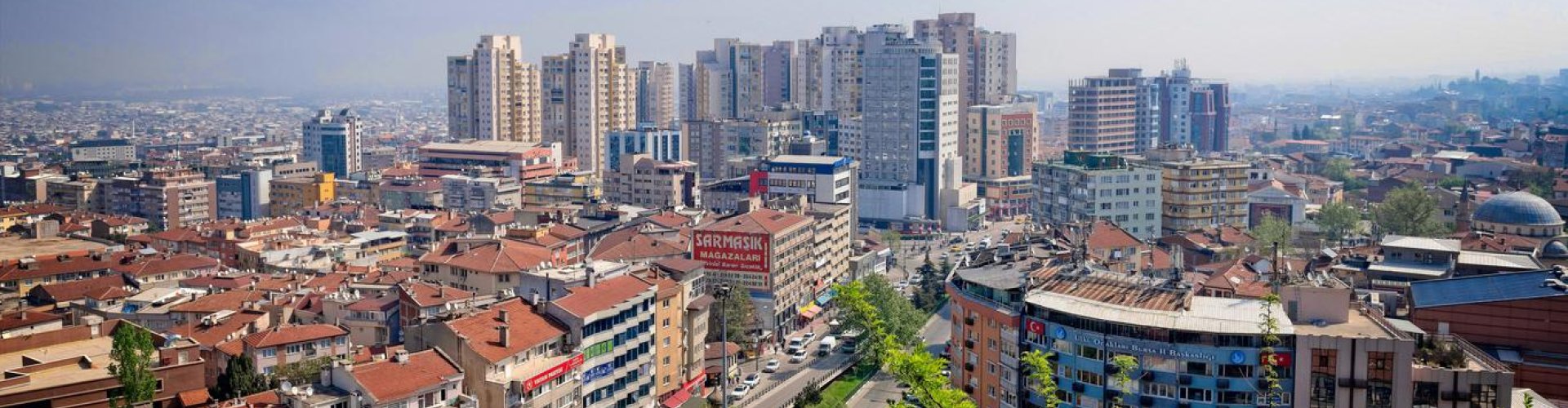 Bursa night skyline with parked cars