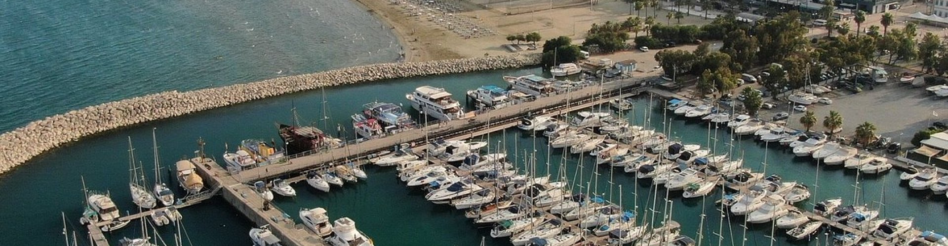 Larnaca night skyline with parked cars