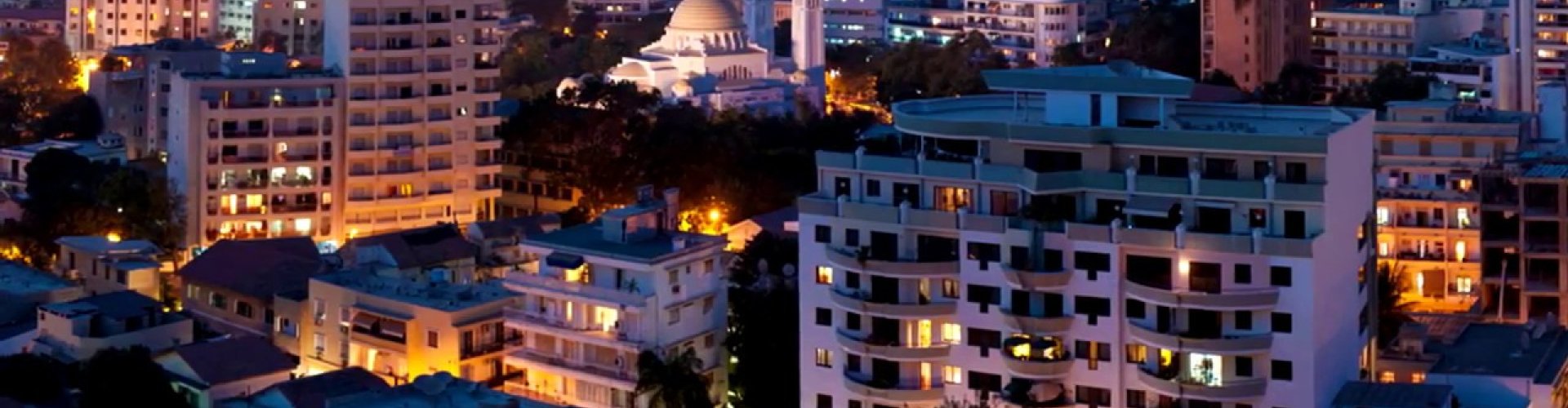 Dakar night skyline with parked cars