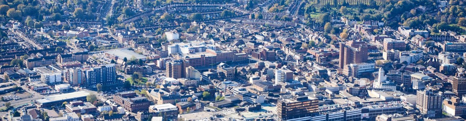 Luton night skyline with parked cars