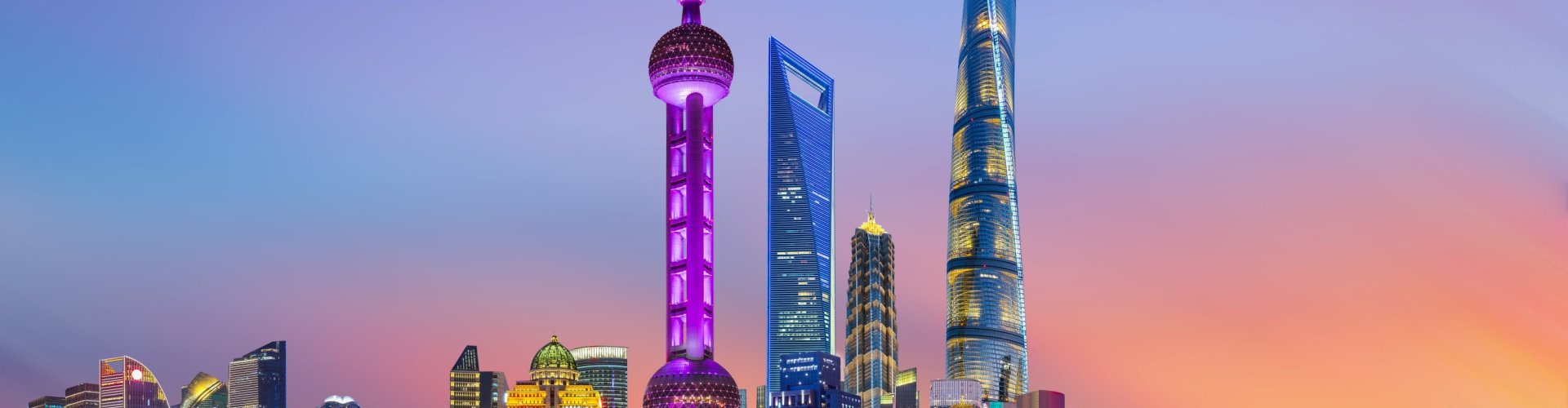 Shanghai night skyline with parked cars