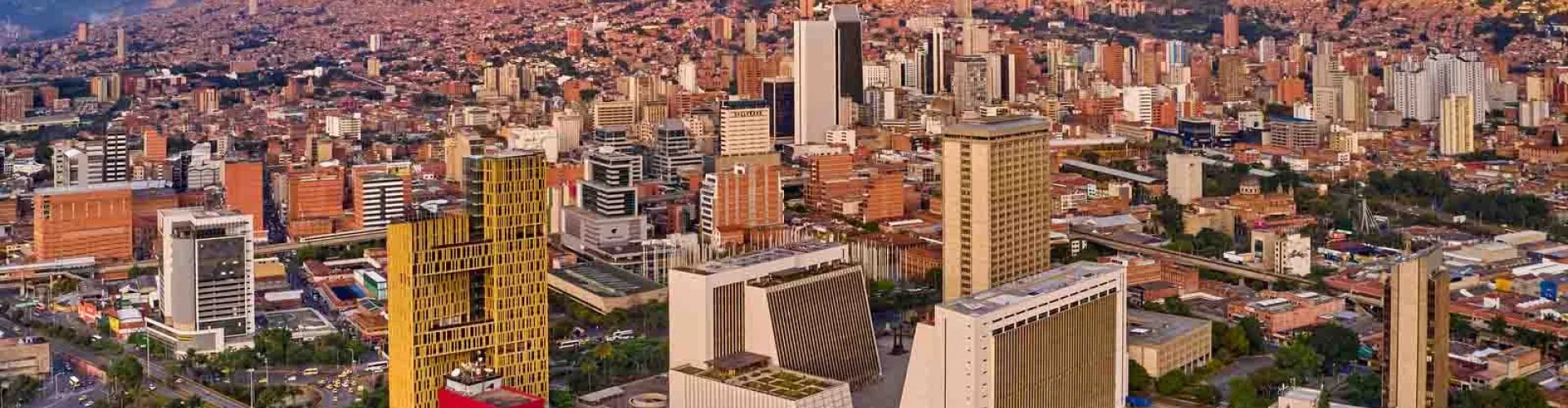 Medellin night skyline with parked cars
