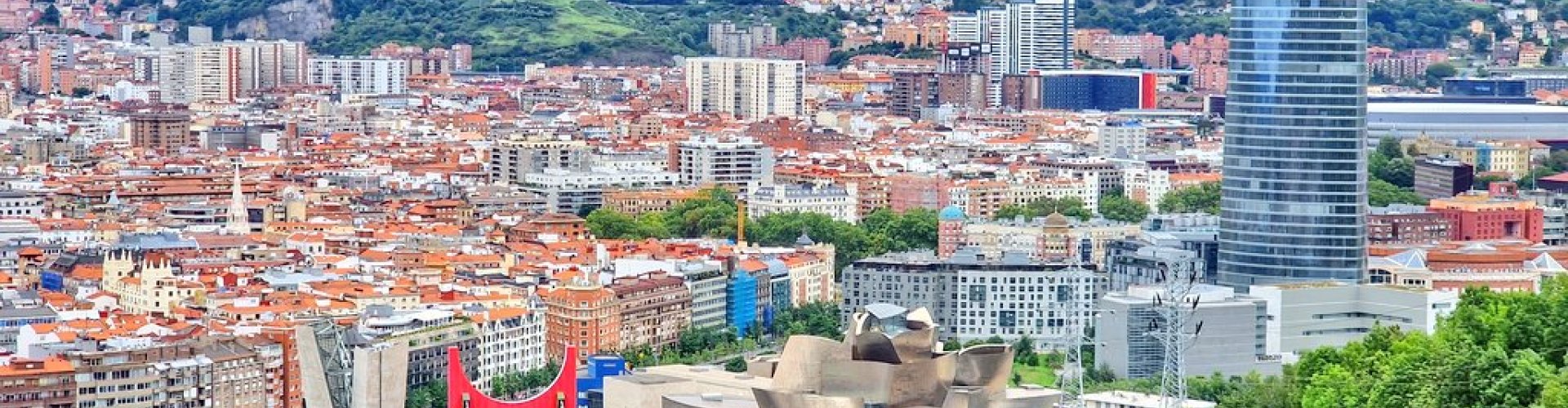 Bilbao night skyline with parked cars