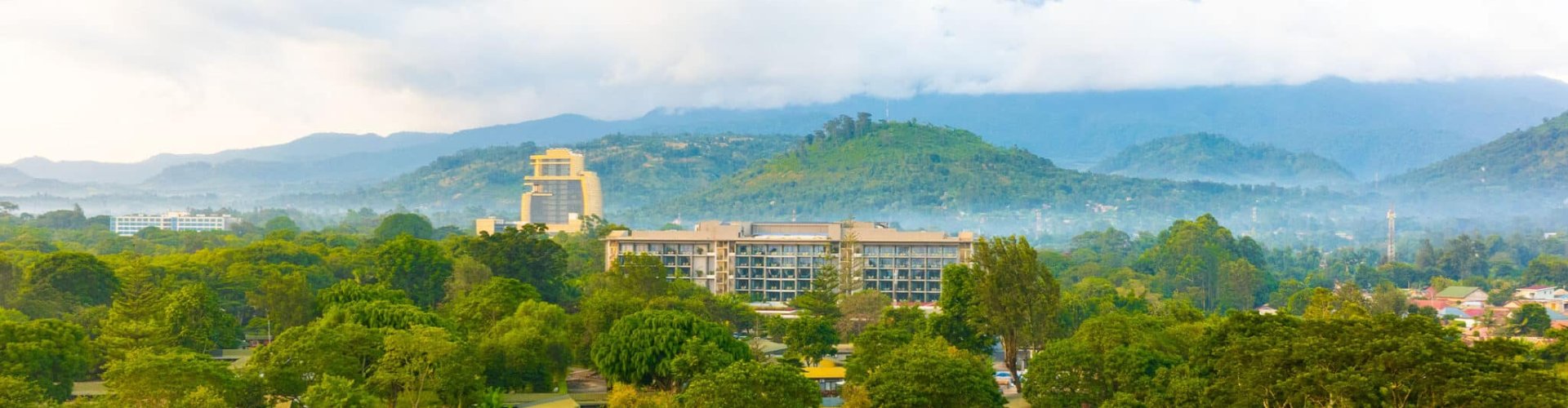 Arusha night skyline with parked cars