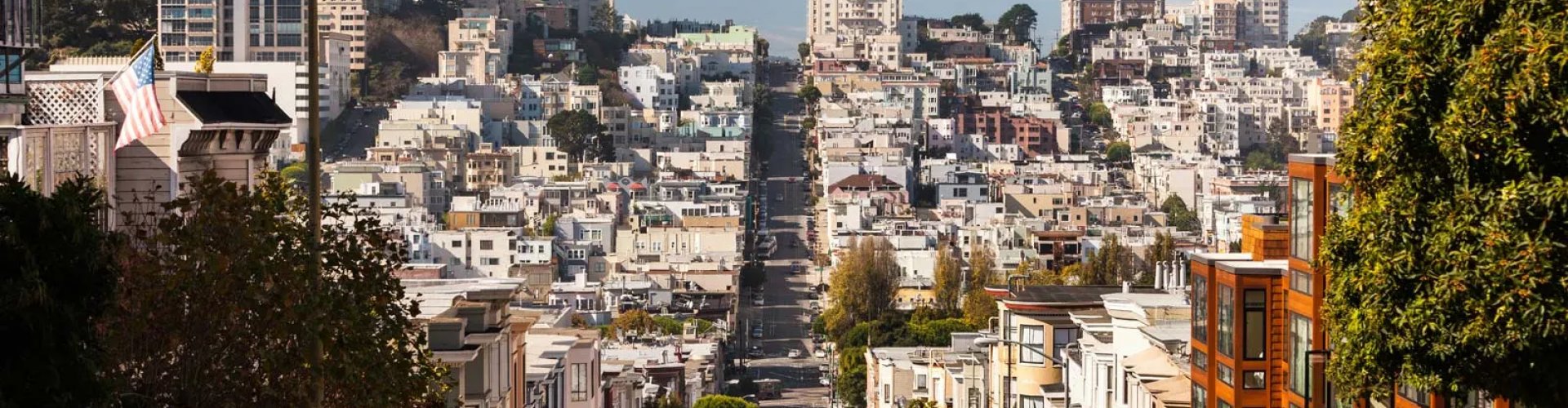 San Francisco night skyline with parked cars