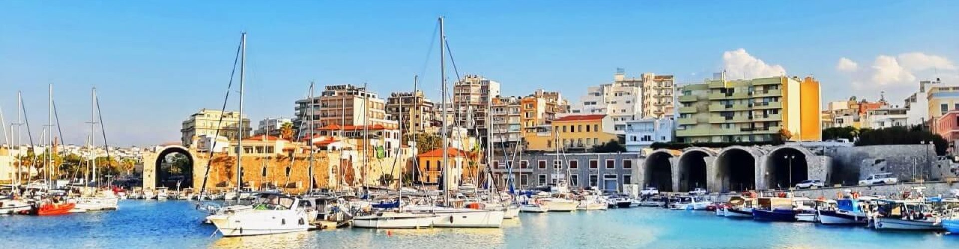 Heraklion night skyline with parked cars