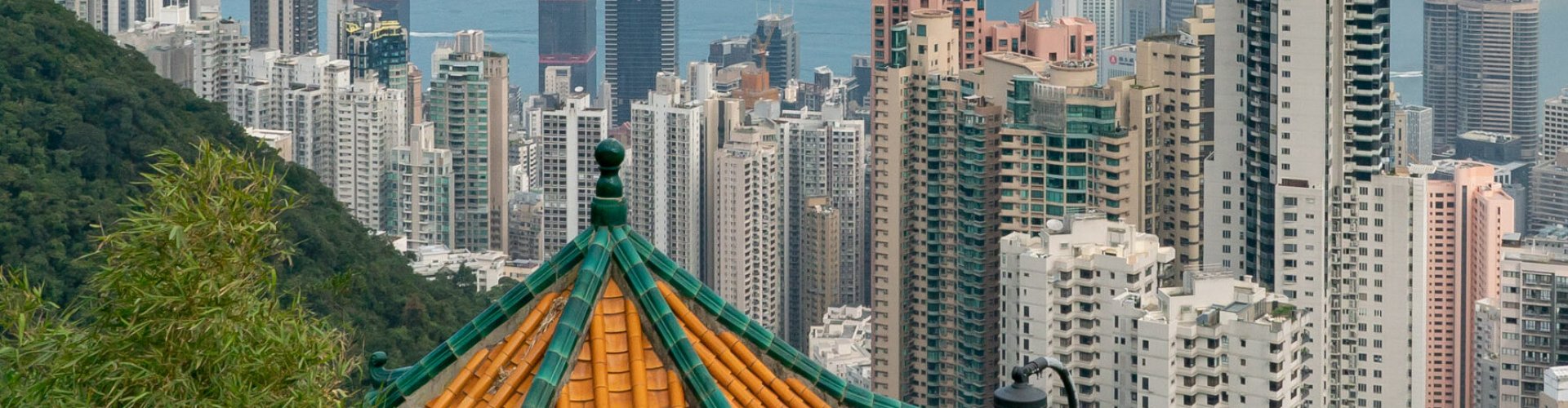 Hong Kong night skyline with parked cars