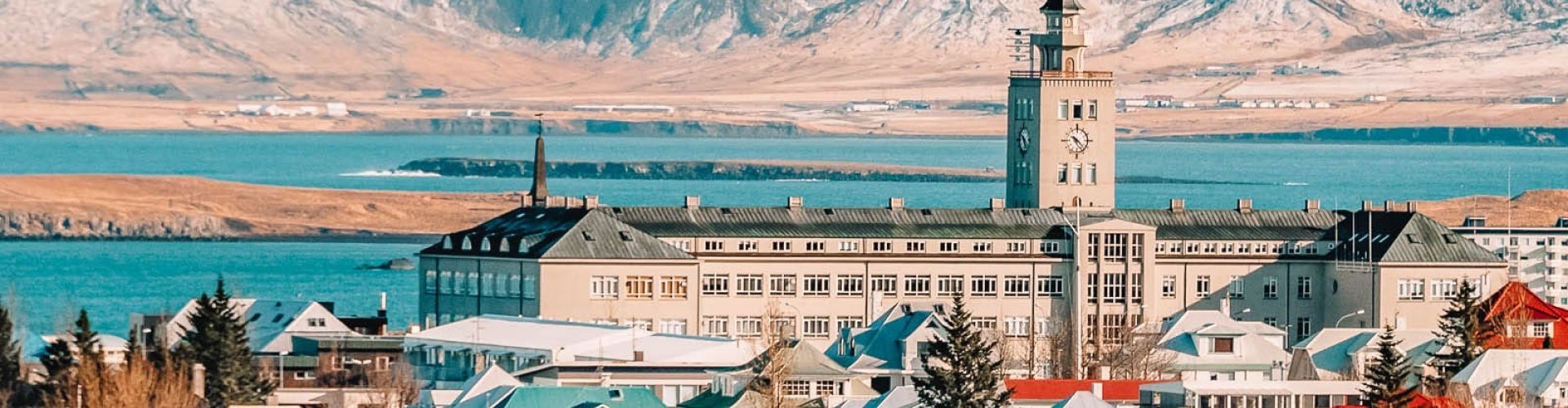 Reykjavík night skyline with parked cars