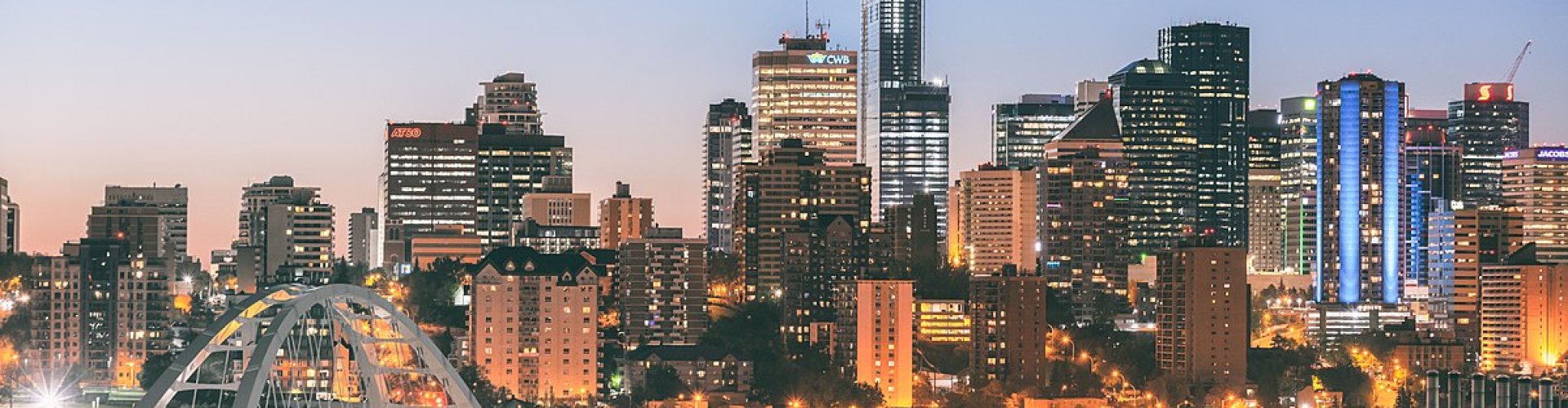 Edmonton night skyline with parked cars