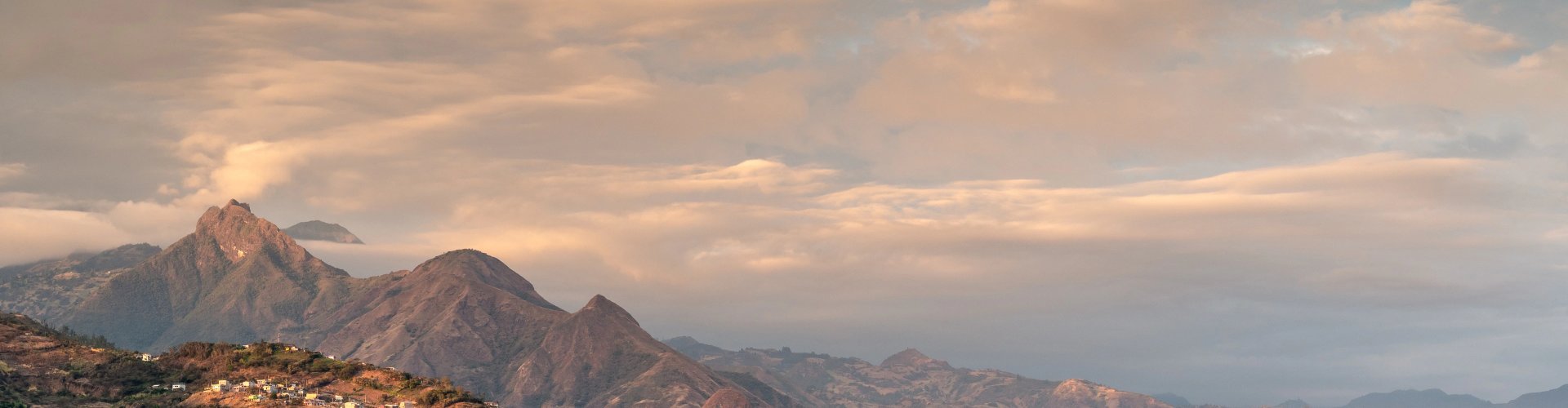 Machala night skyline with parked cars