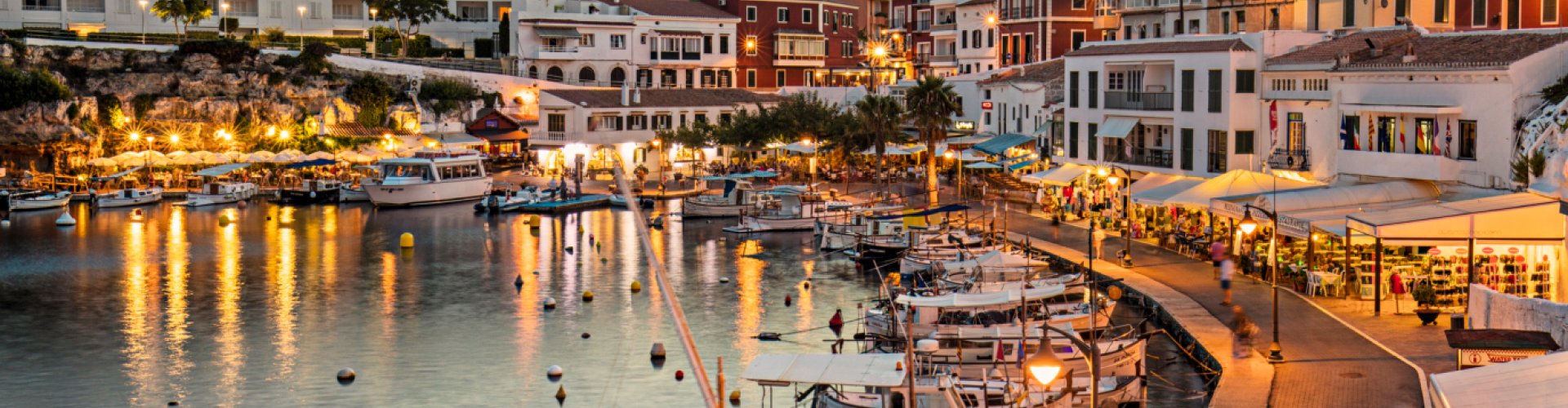 Menorca night skyline with parked cars