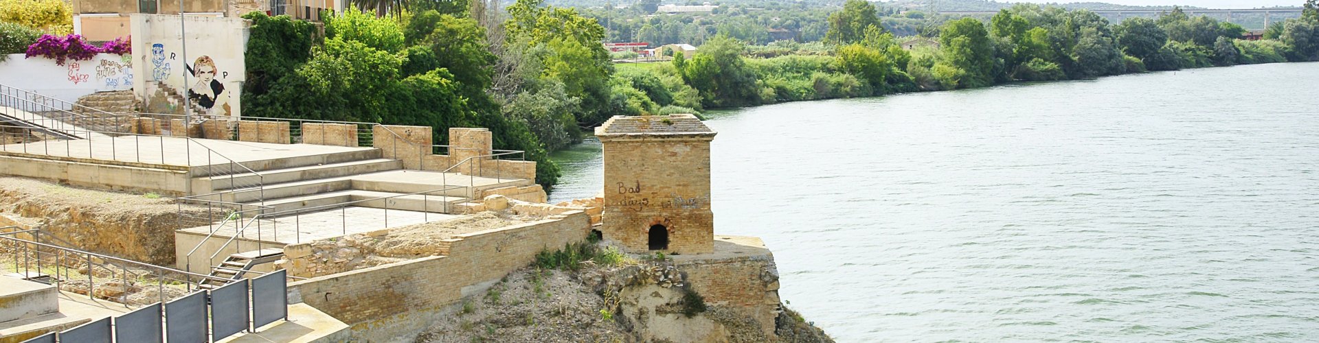 Amposta night skyline with parked cars