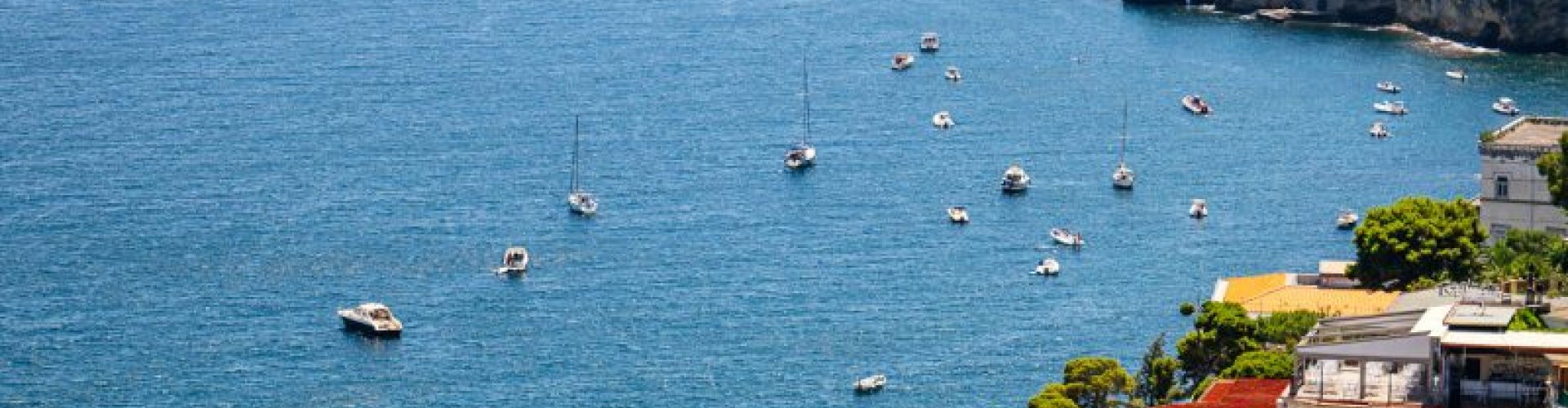 Naples night skyline with parked cars