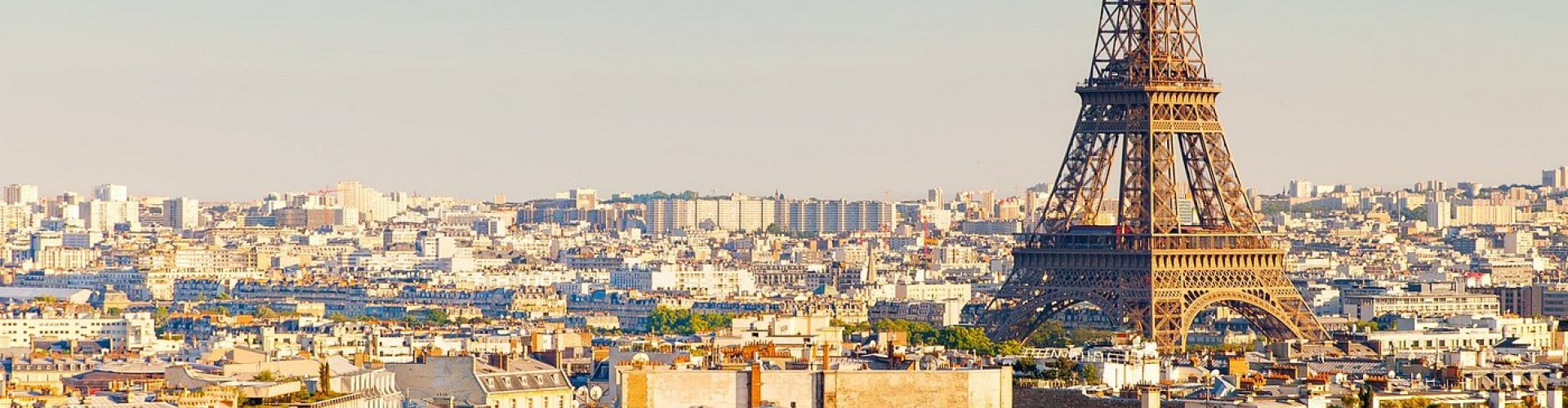 Paris night skyline with parked cars