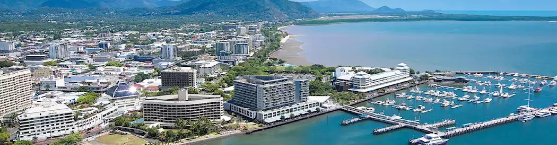 Cairns night skyline with parked cars