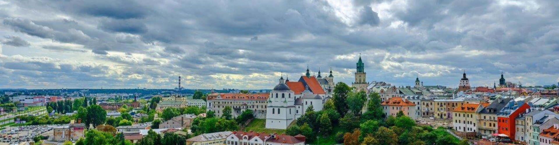 Lublin night skyline with parked cars