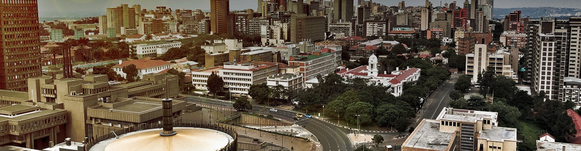 Johannesburg night skyline with parked cars