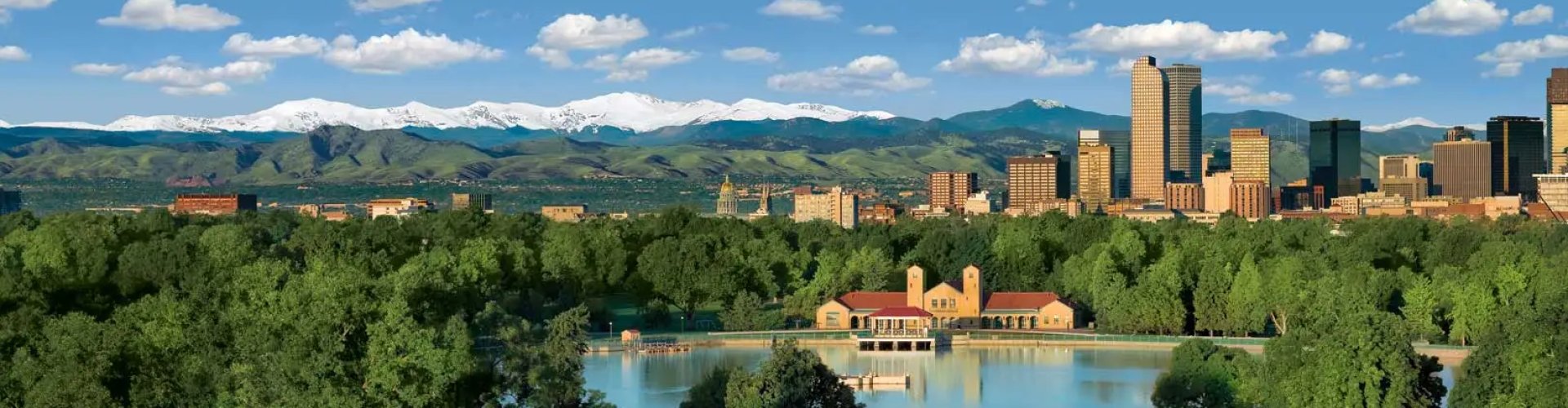 Denver night skyline with parked cars