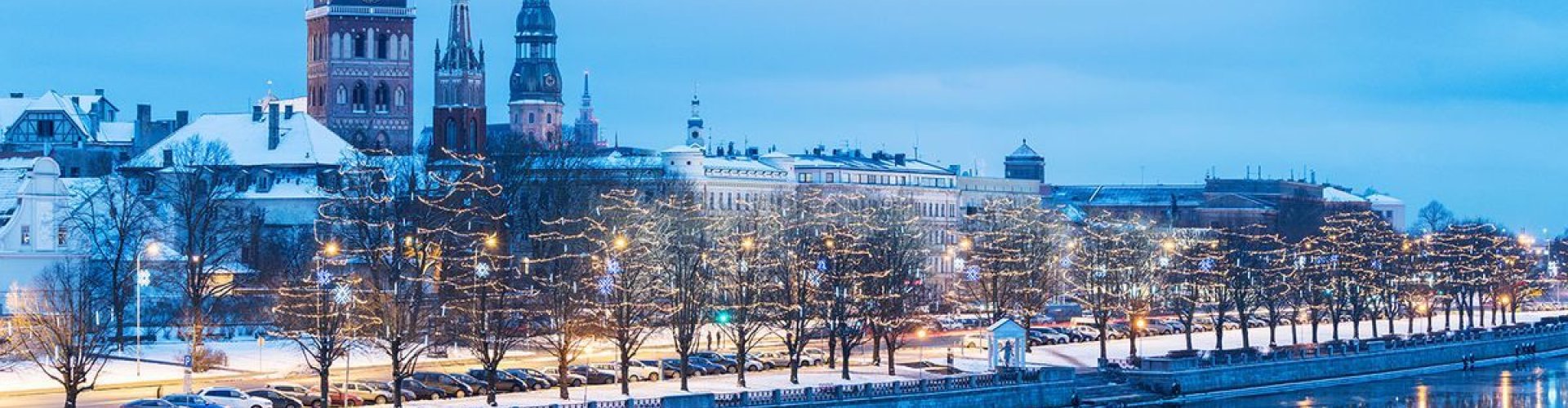 Rīga night skyline with parked cars