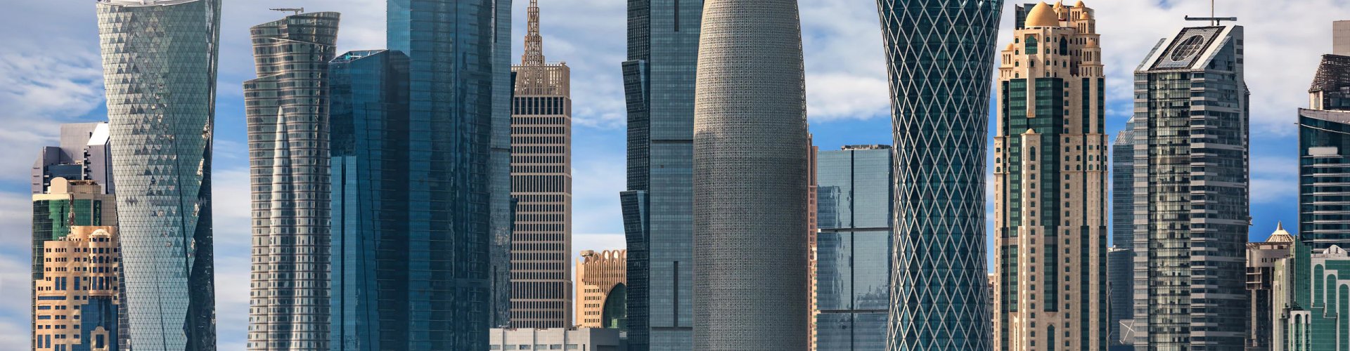 Doha night skyline with parked cars