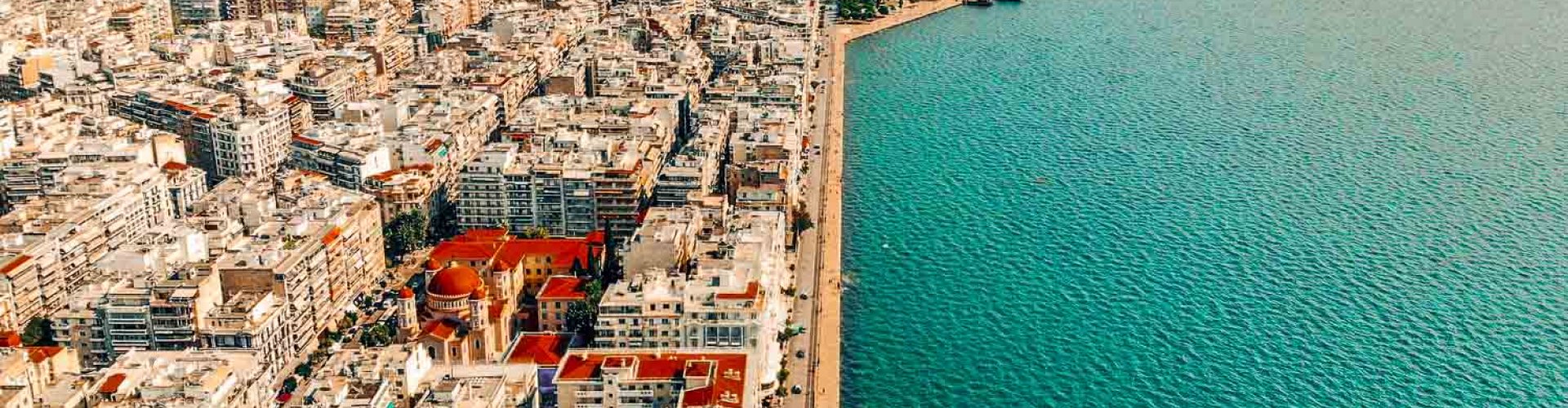 Thessaloniki city night skyline with parked cars