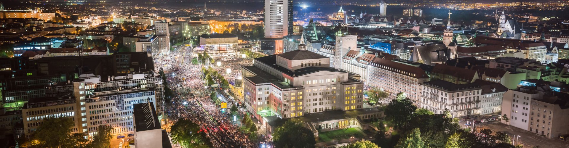 Leipzig night skyline with parked cars