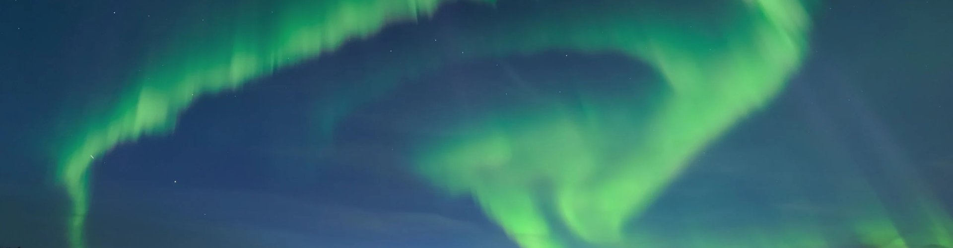 Oulu night skyline with parked cars