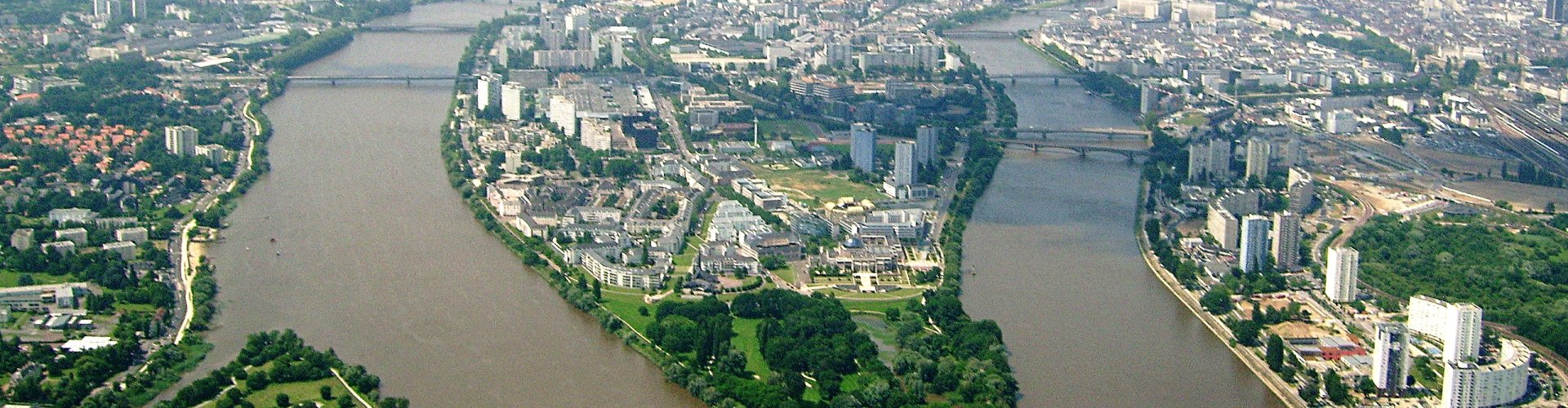 Nantes night skyline with parked cars