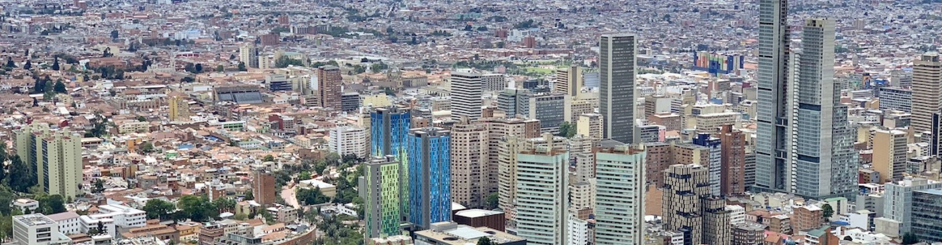 Bogotá night skyline with parked cars