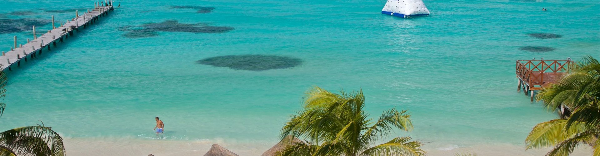 Cancún night skyline with parked cars