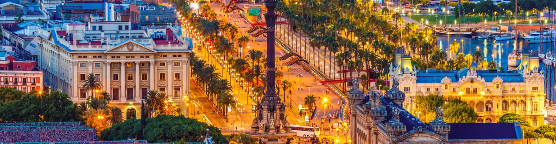 Night skyline of Barcelona with parked cars