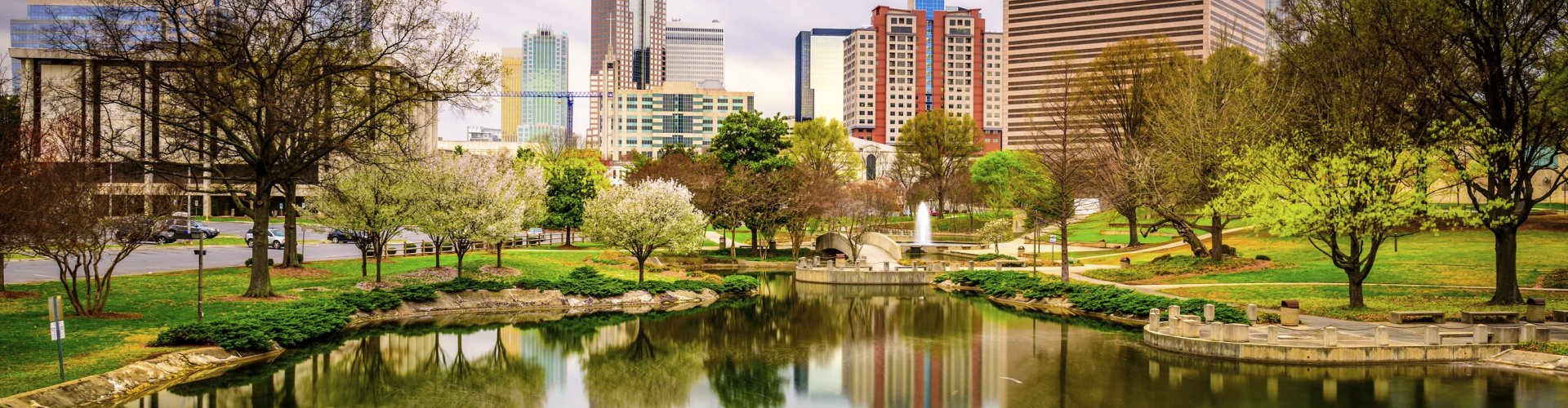 Charlotte night skyline with parked cars