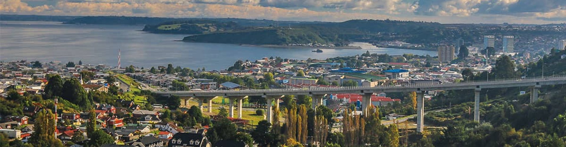 Puerto Montt night skyline with parked cars