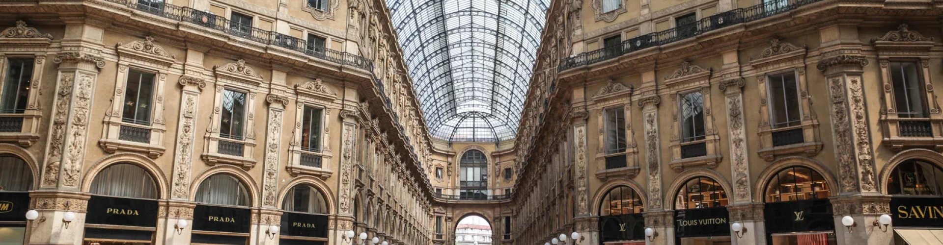 Milan night skyline with parked cars